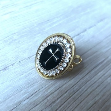 Bague réglable croix doré noir.